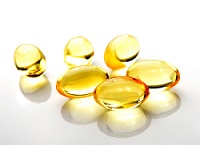 Fish oil pill on white background